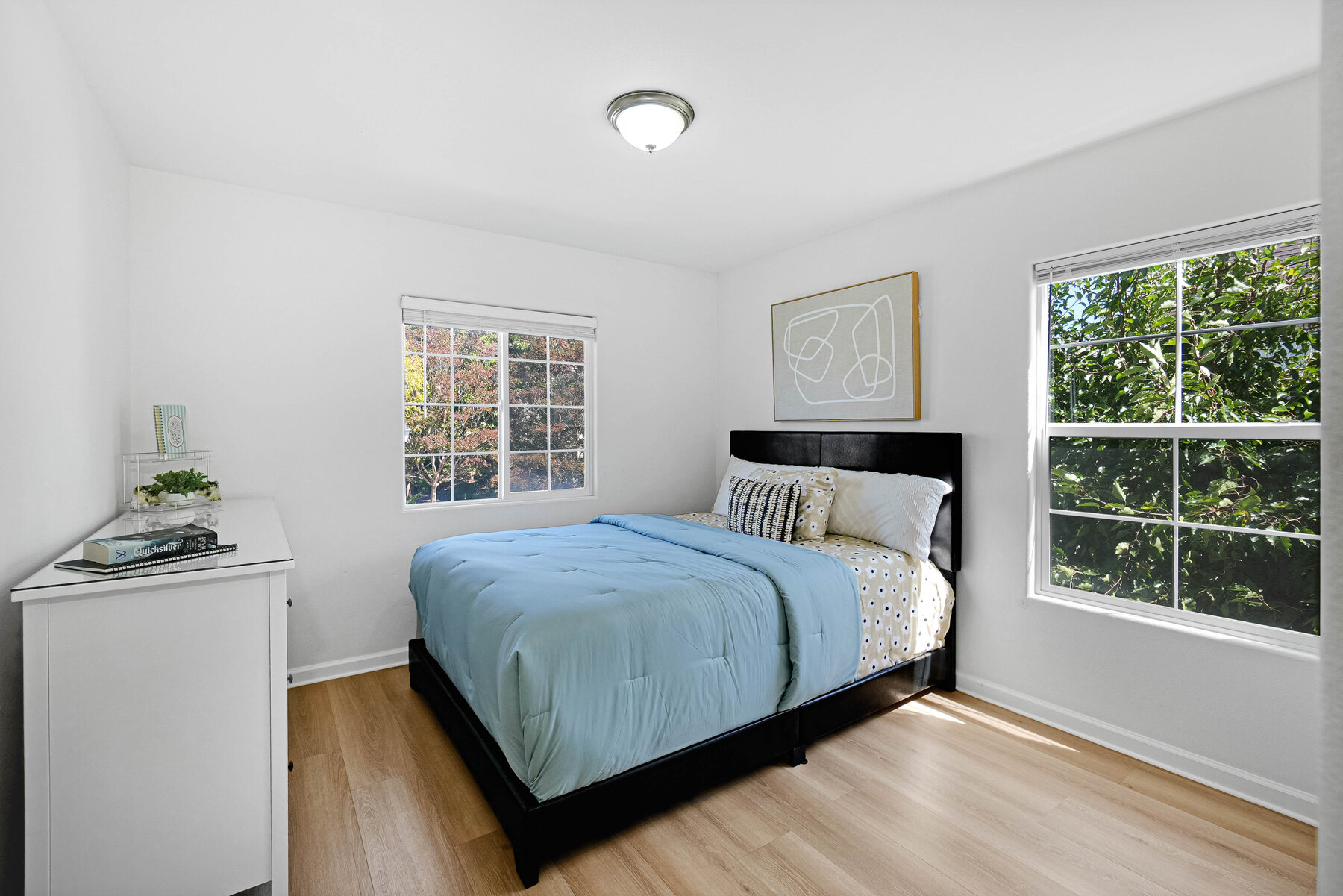 Secondary bedroom with blue bedding