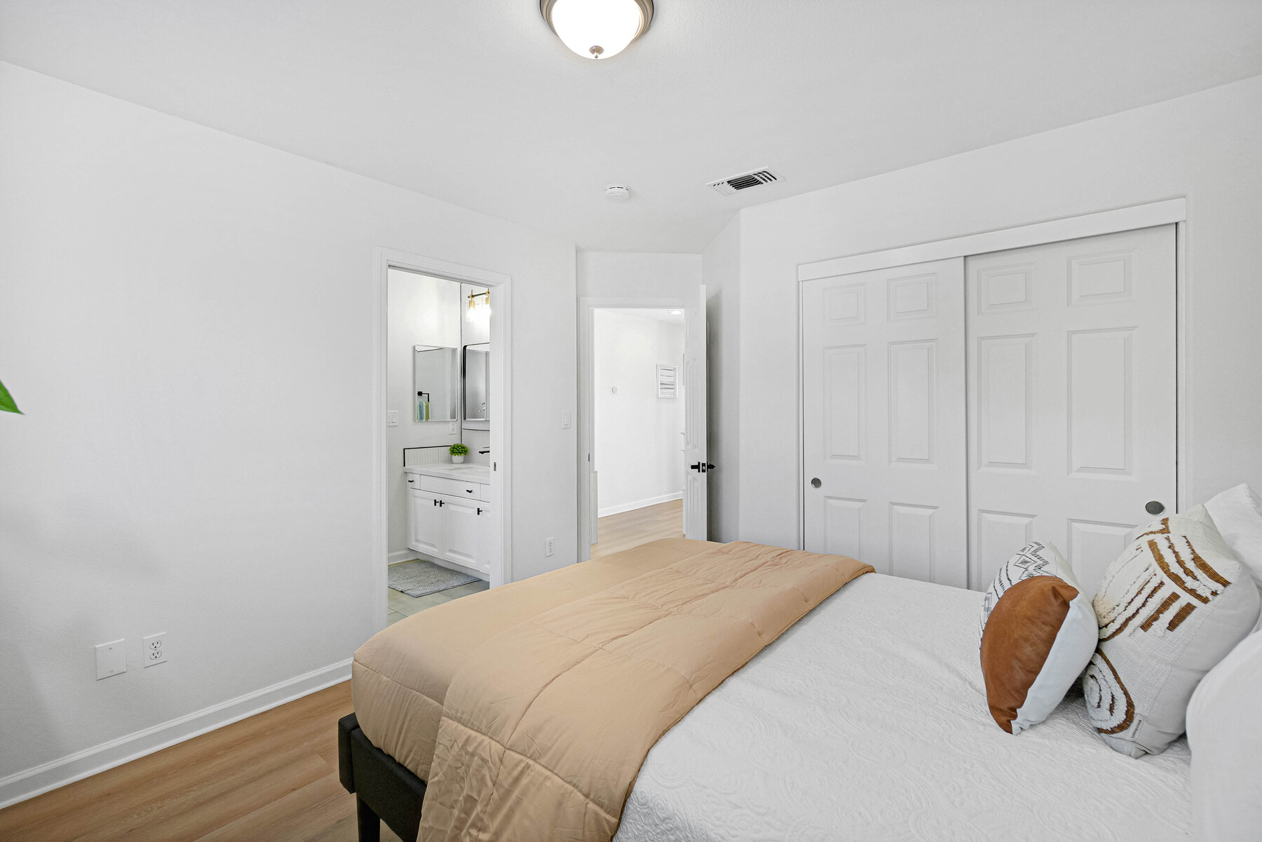 Secondary bedroom with warm neutral styling
