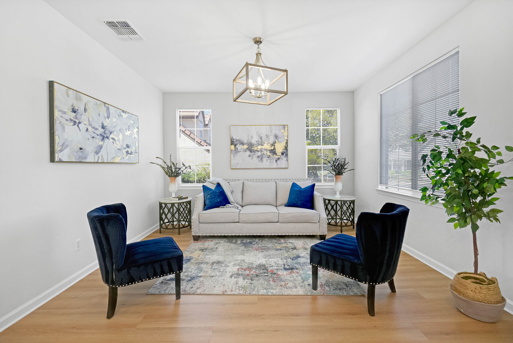 Formal living space with blue chairs